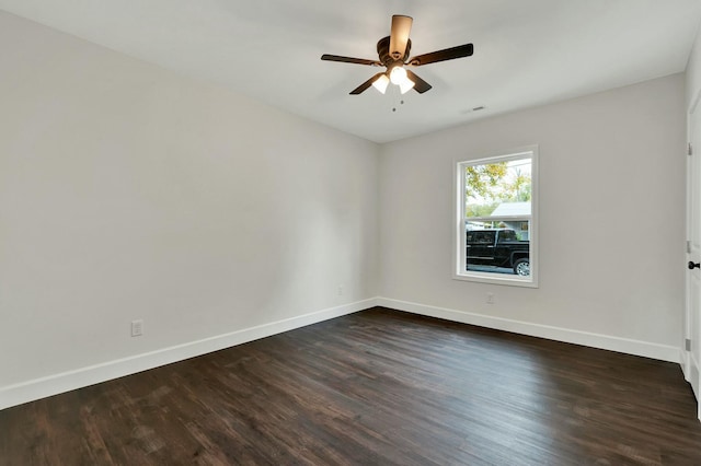 unfurnished room featuring ceiling fan and dark hardwood / wood-style flooring