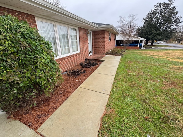 property entrance with a yard