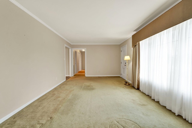 carpeted spare room with ornamental molding