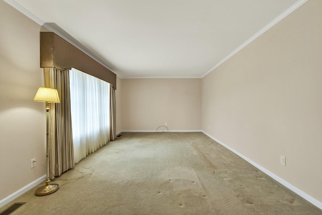 carpeted empty room with crown molding