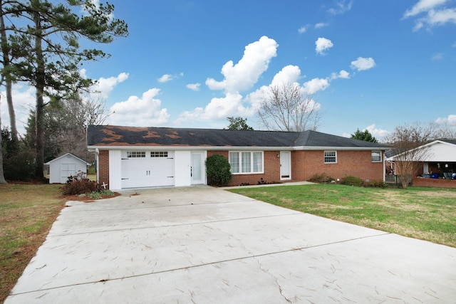 single story home featuring a garage, a storage shed, and a front yard