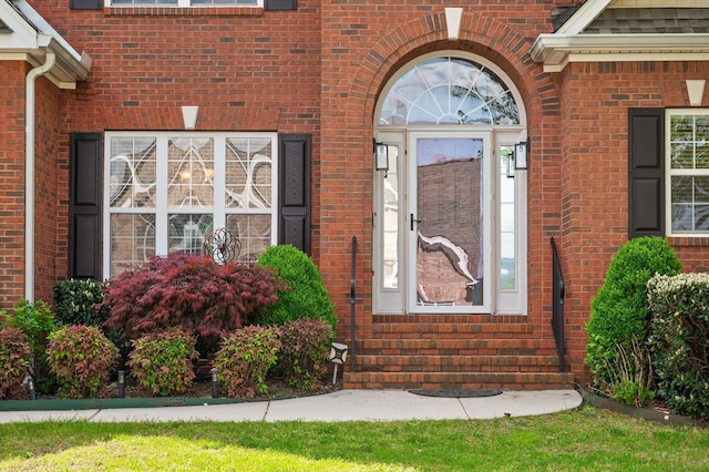 property entrance with brick siding