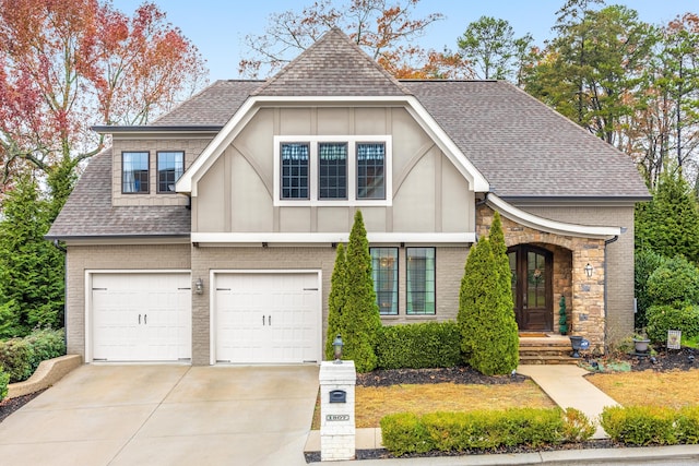 tudor house featuring a garage