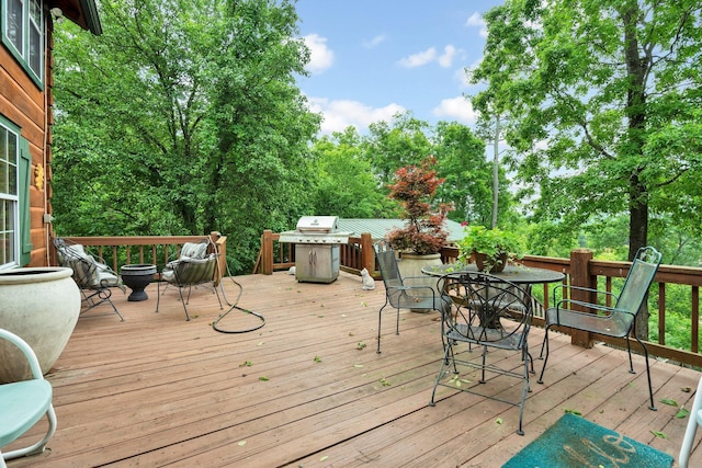 362 River Run Rd, Calhoun, TN 37309 - wooden terrace featuring outdoor dining space and a grill