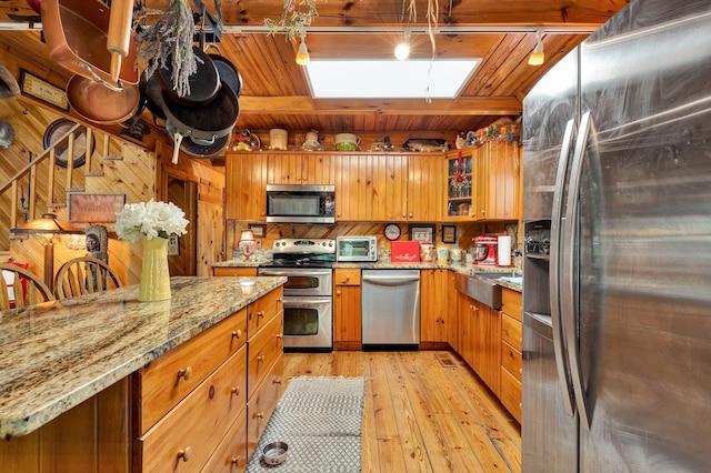 362 River Run Rd, Calhoun, TN 37309 - kitchen with appliances with stainless steel finishes, light wood-type flooring, brown cabinets, light stone countertops, and wooden ceiling