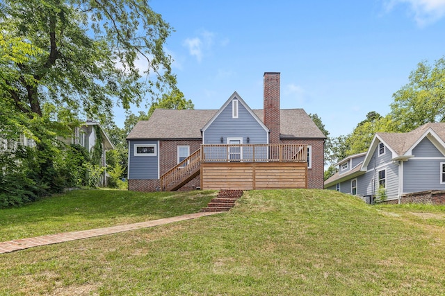 back of property with a deck and a lawn