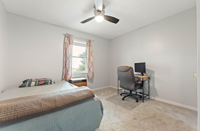 bedroom with ceiling fan and light colored carpet