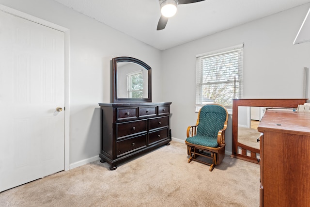 sitting room featuring ceiling fan and light carpet