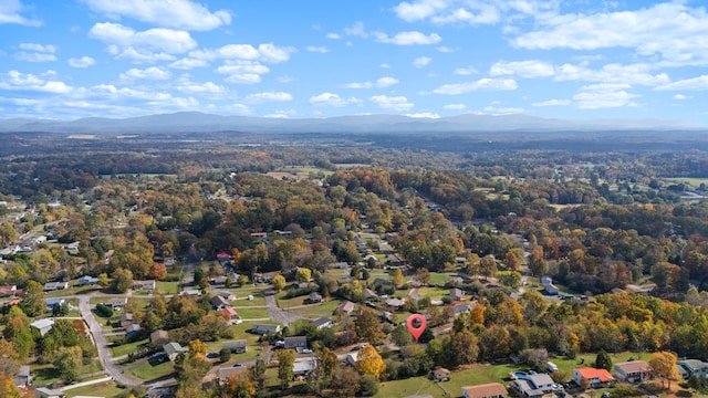 birds eye view of property with a mountain view