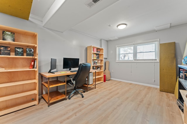 office area with crown molding and light hardwood / wood-style floors