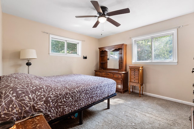 bedroom with ceiling fan and carpet floors