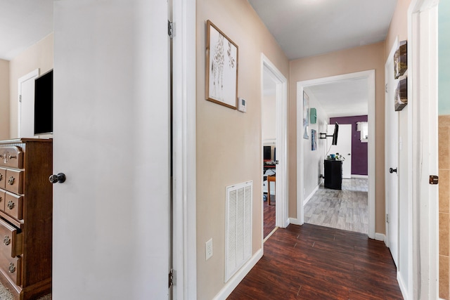 corridor featuring dark hardwood / wood-style flooring