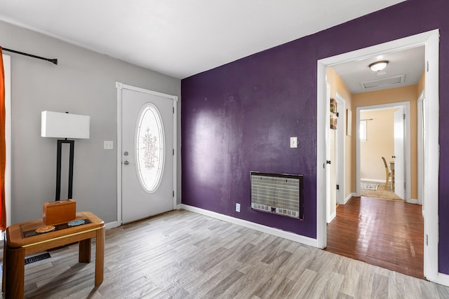 entryway featuring light hardwood / wood-style floors and heating unit