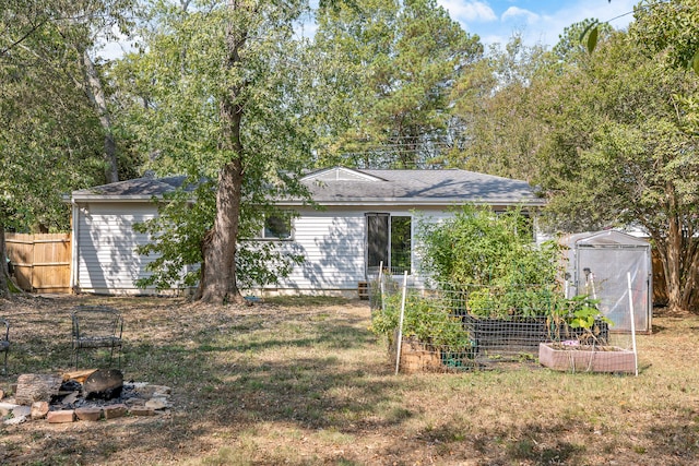 exterior space with a lawn and an outbuilding