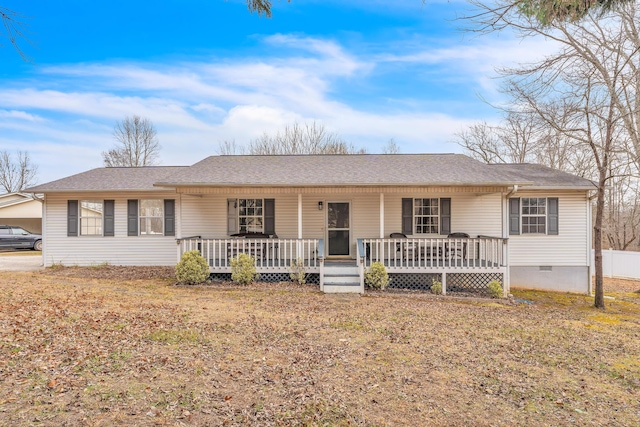 ranch-style home with a front lawn and covered porch