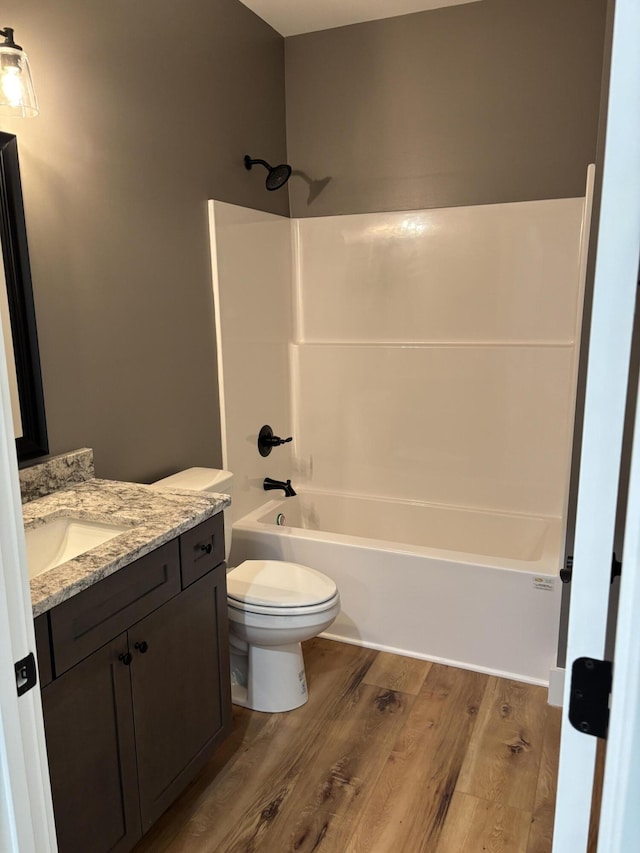 2901 Bobo Ave NW, Cleveland, TN 37312 - bathroom featuring wood finished floors, vanity, and bathtub / shower combination