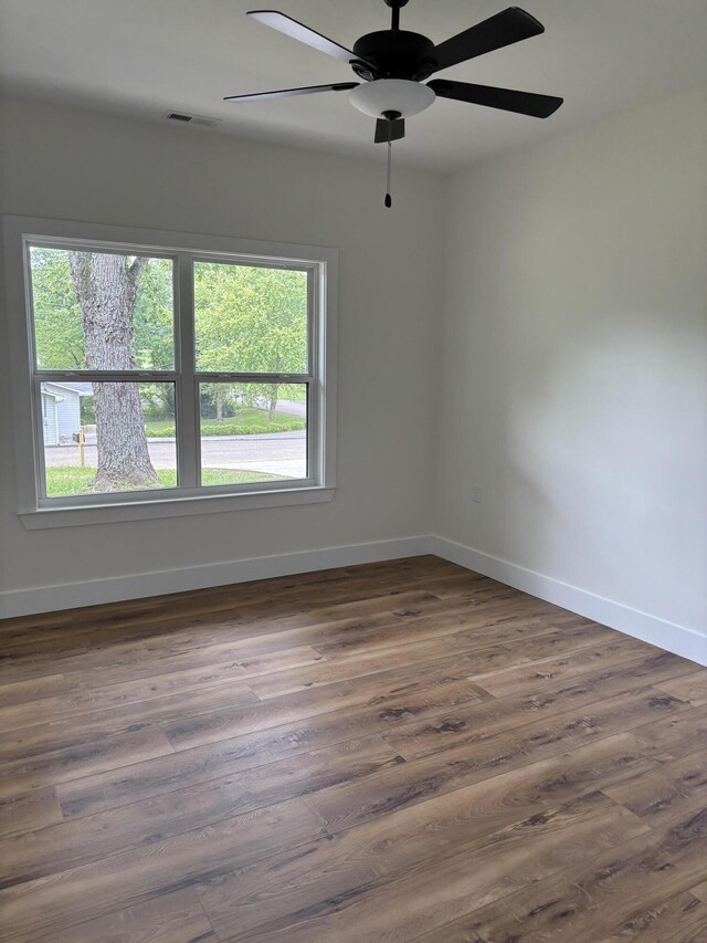 2901 Bobo Ave NW, Cleveland, TN 37312 - empty room featuring healthy amount of natural light, dark wood-style flooring, and ceiling fan