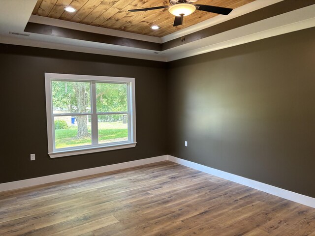 2901 Bobo Ave NW, Cleveland, TN 37312 - unfurnished room featuring wooden ceiling, a raised ceiling, wood finished floors, and a ceiling fan