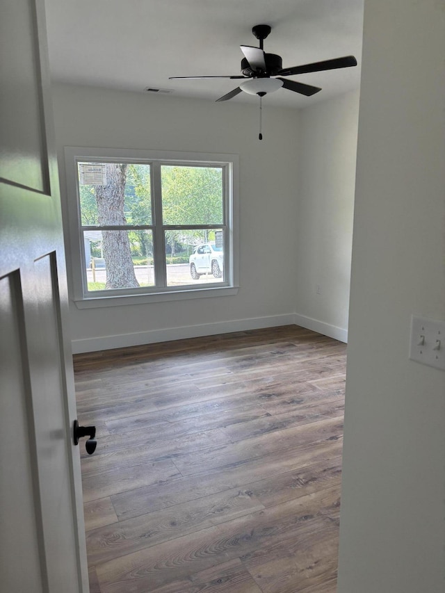 2901 Bobo Ave NW, Cleveland, TN 37312 - spare room with wood finished floors and ceiling fan