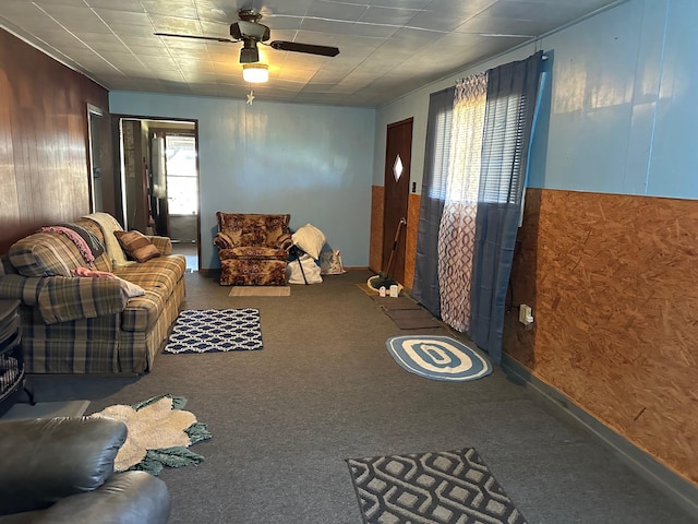 unfurnished living room with carpet flooring and ceiling fan