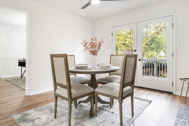 dining room featuring light wood-type flooring and ceiling fan