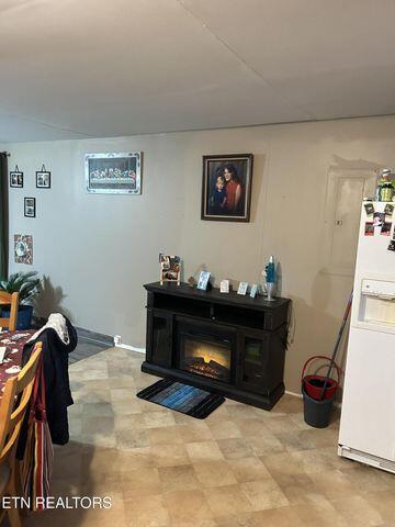 interior space with a glass covered fireplace