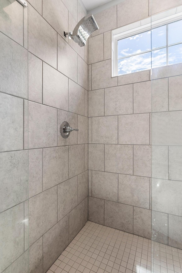 bathroom with tiled shower