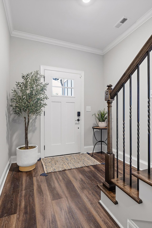 foyer entrance featuring hardwood / wood-style flooring and ornamental molding