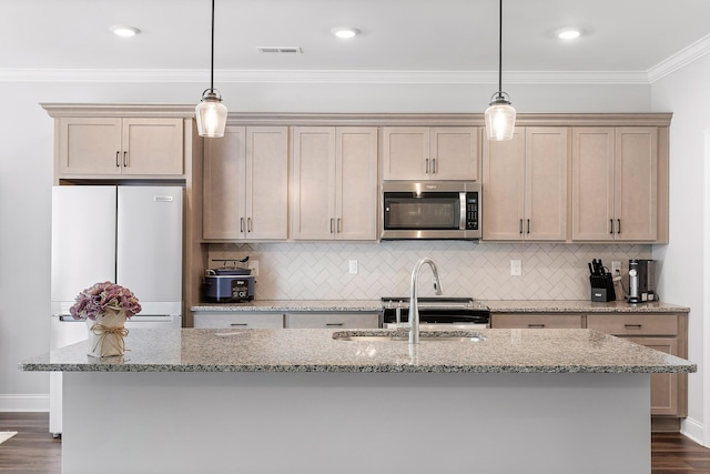 kitchen with decorative light fixtures, light stone counters, dark hardwood / wood-style floors, and white fridge