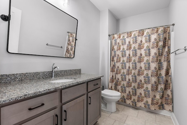 bathroom featuring tile patterned floors, vanity, curtained shower, and toilet