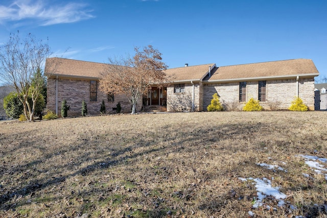 ranch-style house with a front lawn