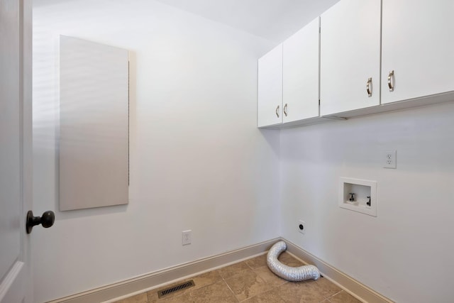 washroom with washer hookup, cabinets, and electric dryer hookup