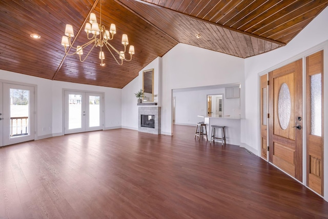 unfurnished living room with an inviting chandelier, wood ceiling, dark hardwood / wood-style floors, french doors, and vaulted ceiling