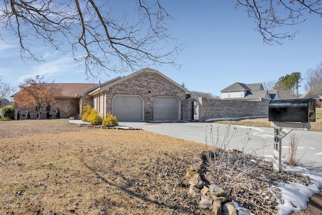 ranch-style house with a front lawn and a garage