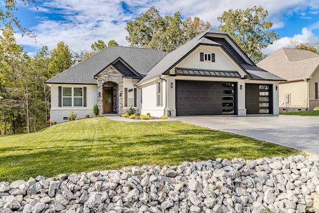 view of front of property with a garage and a front yard