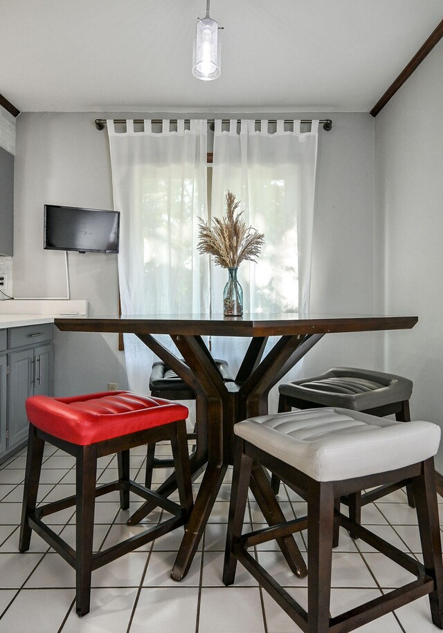 dining area featuring light tile patterned flooring