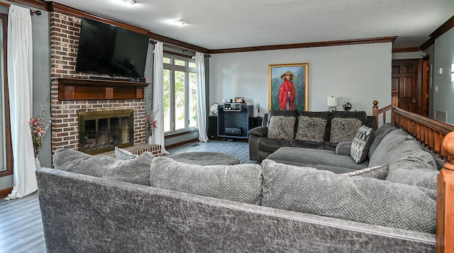 living room featuring a fireplace, hardwood / wood-style flooring, and crown molding