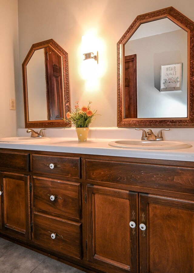 bathroom featuring tile patterned flooring and vanity