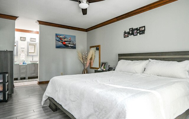 bedroom featuring dark hardwood / wood-style floors, ceiling fan, and crown molding