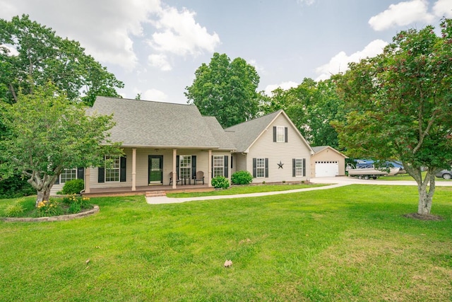 328 Mill Hamlet Rd NW, Charleston, TN 37310 - view of front of house with covered porch, a front yard, a detached garage, and driveway