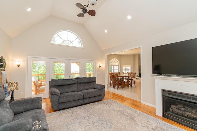 328 Mill Hamlet Rd NW, Charleston, TN 37310 - living area featuring plenty of natural light, wood finished floors, high vaulted ceiling, french doors, and a ceiling fan