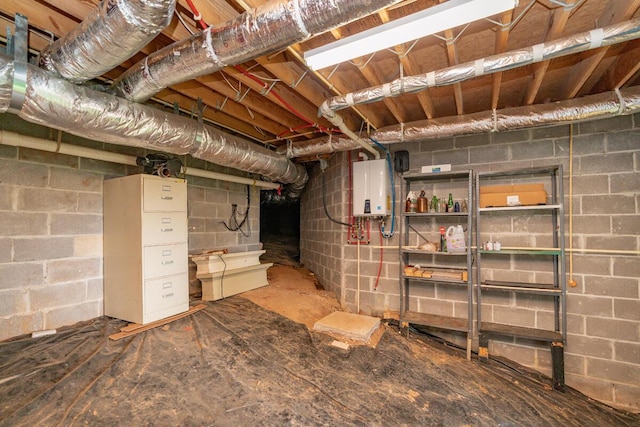 328 Mill Hamlet Rd NW, Charleston, TN 37310 - unfinished basement featuring tankless water heater and concrete block wall