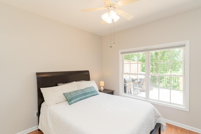328 Mill Hamlet Rd NW, Charleston, TN 37310 - bedroom featuring baseboards, wood finished floors, and ceiling fan