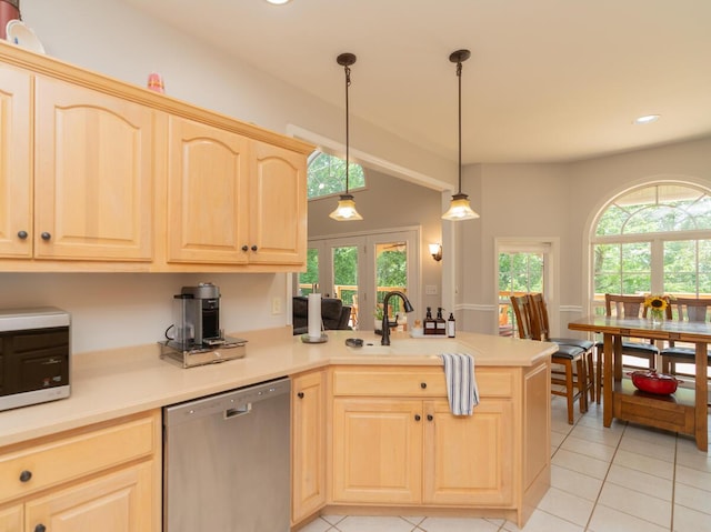328 Mill Hamlet Rd NW, Charleston, TN 37310 - kitchen with stainless steel dishwasher, light brown cabinetry, a peninsula, a sink, and light tile patterned flooring