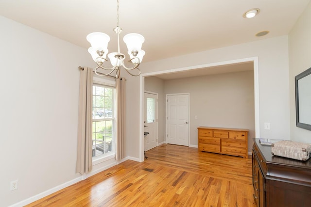 328 Mill Hamlet Rd NW, Charleston, TN 37310 - foyer featuring a chandelier, light wood-style flooring, and baseboards
