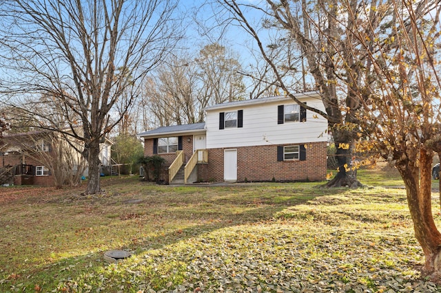 split level home with a front yard