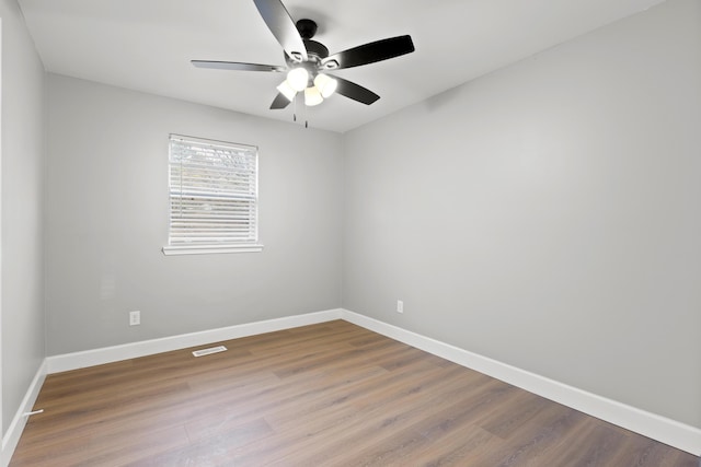 unfurnished room featuring hardwood / wood-style floors and ceiling fan