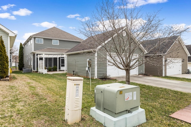 view of front facade featuring a garage, concrete driveway, a shingled roof, and a front yard