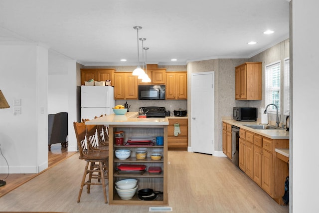 kitchen featuring a sink, open shelves, light wood-style floors, and black appliances