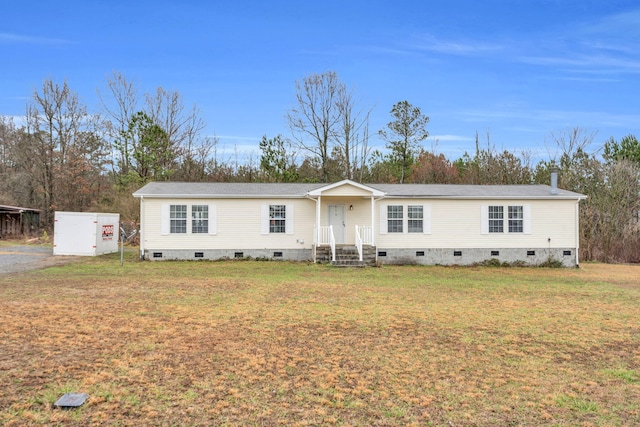 manufactured / mobile home featuring crawl space and a front lawn